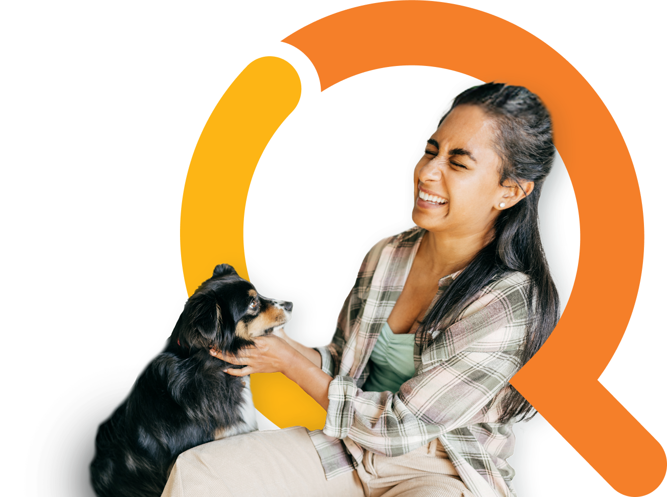 Woman with long brown hair wearing a plaid shirt playing with a small dog