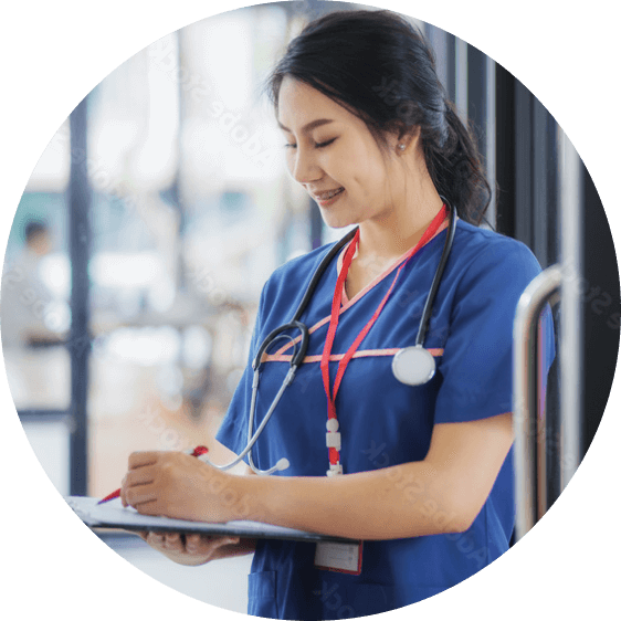 Actor portrayal of a female nurse in scrubs with a stethoscope around her neck writing on a clipboard